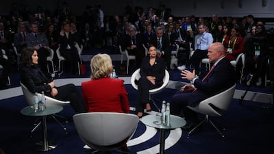 Michigan Governor Gretchen Whitmer, left, and Alexandria Ocasio-Cortez, centre, US representative for New York's 14th congressional district, listen as US ambassador to Nato Matthew Whitaker speaks during a townhall panel on US foreign policy. Getty Images