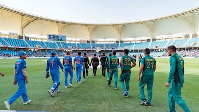 India and Pakistan players go out onto the field before the Dubai game. Chris Whiteoak / The National