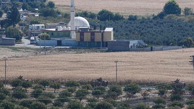 This picture from the Turkish side of the border at Ceylanpinar district in Sanliurfa shows Turkish army armoured vehicles driving near the Syrian town of Ras Al Ain on the first week of Turkey's military operation against Kurdish forces. AFP