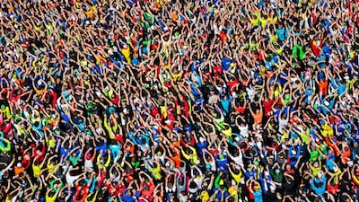 Sascha Fromm, Germany, Theuringer Allgemeine: Runners wave and dance before they start to the “GutsMuths Rennsteiglauf” cross country run. This image is a finalist in the photography category of the inaugural Sport Media Pearl Awards, which is managed by the International Sports Press Association (AIPS) and hosted by Abu Dhabi Media, publishers of The National.