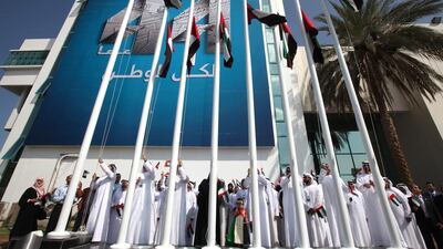 Here in Abu Dhabi, we raise UAE flags outside the Abu Dhabi Media head office. Brian Kerrigan / The National