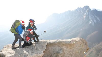 Mountaineers take a selfie during a stop on a climb in South Korea. Jeon Heon-Kyun / EPA