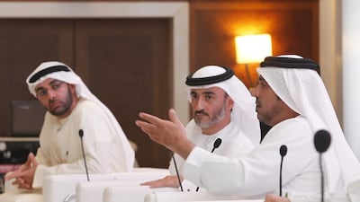 Dr Abdullah Al Rais, the chairman of the competition, right, Majid Al Bastaki, the deputy chairman, middle, and board member Ali Al Shaali announce the competition in Dubai yesterday. Jeffrey E Biteng / The National
