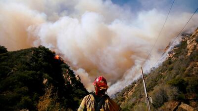 Firefighters battle the Woolsey Fire as it continues to burn in Malibu, California. Reuters