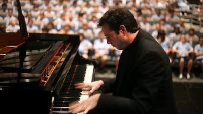 The concert pianist Ioannis Potamousis performs for children at the British School Al Khubairat in Abu Dhabi.