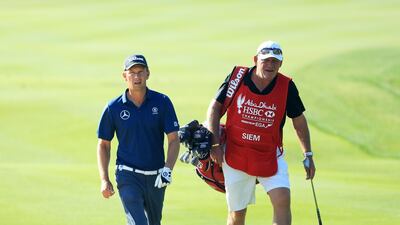 Marcel Siem of Germany wand his caddie walk on the 13th hole at Abu Dhabi Golf Club. Andrew Redington / Getty Images