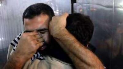 A man mourns the loss of a relative, killed in an Israeli air strike, at the mortuary of a hospital in Gaza City yesterday.