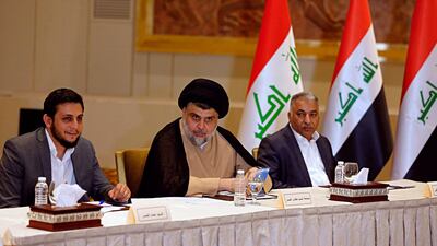 Shiite cleric Muqtada Al Sadr, center, whose coalition won the largest number of seats in Iraq's parliamentary elections, meets Prime Minister and other Iraqi politicians during the negotiations to form a new government in Baghdad, Iraq. AP
