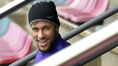 Barcelona's Neymar arrives at training on Saturday to prepare for Sunday's La Liga match against Real Madrid. Lluis Gene / AFP