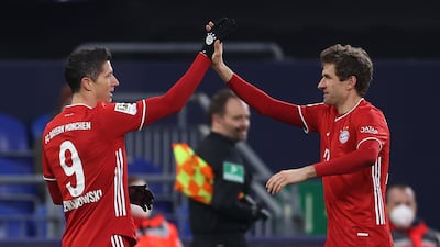 Robert Lewandowski celebrates with teammate Thomas Muller after scoring Bayern's second goal. Getty