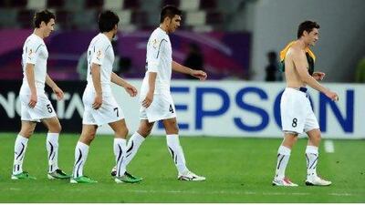 Dejected Uzbekistan players leave the field after their 6-0 semi-final mauling at the hands of Australia on Tuesday.