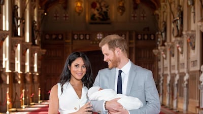 Britain's Prince Harry, Duke of Sussex and Meghan, Duchess of Sussex, pose for a photo with their newborn baby son in St George's Hall at Windsor Castle in Windsor, west of London on May 8, 2019. AFP