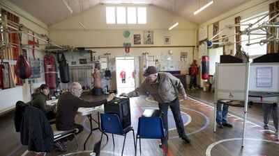 Voters at East Hull Amateur Boxing Club , one of the polling stations in Hull, Northern England, cast their ballots on May 7, 2015. Oli Scarff/AFP Photo