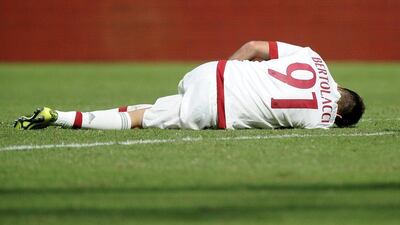 AC Milan's Andrea Bertolacci lies on the pitch during their Serie A match against Genoa last weekend. Giorgio Perottino / Reuters / September 27, 2015