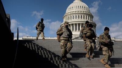 Members of the National Guard patrol the grounds of the US Capitol in Washington. AFP
