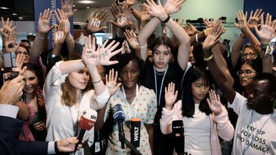 Activists including 11-year-old Licypriya Kangujam from India (in a pink top) protest against Germany's climate policy at the summit. AP Photo