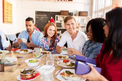Try paying only with cash when you go out to eat with friends. This way, you can’t overspend because you literally don’t have the money. Photo: Alamy