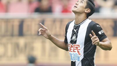 Yoshinori Muto celebrates after scoring for Newcastle against West Ham in the Premier League Asia Trophy. Getty Images