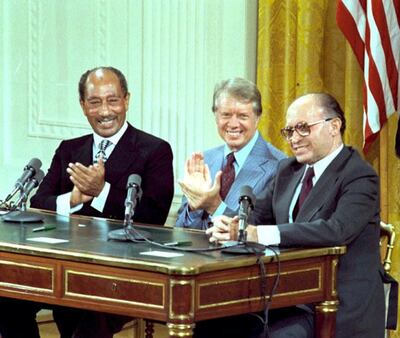 Former leaders Anwar Sadat of Egypt, Jimmy Carter of the US and Menachem Begin of Israel during the signing of the Camp David Accords in 1978. Jimmy Carter Library