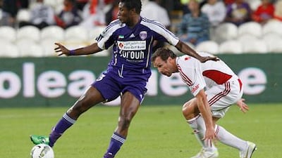 Asamoah Gyan, left, seen here in action against Al Jazira, struggled with injury during Al Ain’s victory against Emirates on Friday night.
