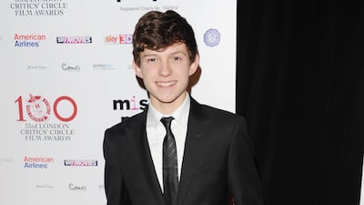 Tom Holland, in a black suit, attends the London Critics' Circle Film Awards on January 20, 2013. Getty Images