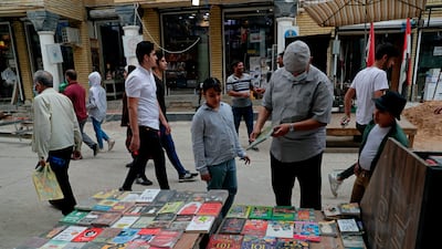 Pupils shop for school supplies in preparation for the new academic year in Baghdad, Iraq. AP