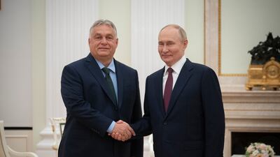 Russian President Vladimir Putin shakes hands with Hungarian Prime Minister Viktor Orban during their meeting at the Kremlin in Moscow. Hungarian Prime Minister's Press Office / AFP