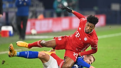 Bayern Munich's Kingsley Coman is challenged by Timo Becker of Schalke. Reuters