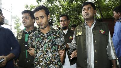 Bangladesh police arrest Shariful Islam, centre, in connection with the murder of rights activist Xulhaz Mannan and his friend Tonoy Fahim, in Dhaka, Bangladesh on May 15, 2016. EPA