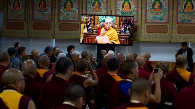 Buddhist monks watch a video message from Tibetan spiritual leader the Dalai Lama, at a gathering in Dharamshala, India, before his 90th birthday on July 6. AP