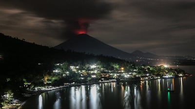 A long exposure photograph shows the Mount Agung volcano spewing hot volcanic ash as seen from Amed, Karangasem regency, Bali, Indonesia. Roni Bintang / EPA