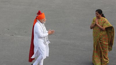 Indian defence minister Nirmala Sitharaman, right, greets Mr. (L) upon his arrival at the Red Fort. EPA