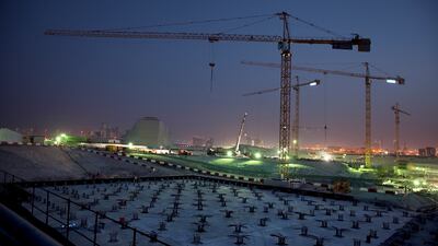 Construction continues into the evening at Louvre Abu Dhabi in May 2013. Silvia Razgova / The National