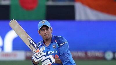 Thirty minutes before the start of the dead-rubber Super Four match between India and Afghanistan, supporters were given an unexpected treat MS Dhoni usually wears whatever clothes he chooses well. When it is full India kit, half an hour ahead of a day’s play, it means one thing: he is captain, heading to the toss. It took quite a run of events for Dhoni to add to his tally of 199 ODIs in which he has captained India. Virat Kohli was absent as he was rested from the series. Stand-in Rohit Sharma and third-choice Shikhar Dhawan were also given the day off together, meaning a belated return to leadership for Dhoni. Pawan Singh / The National