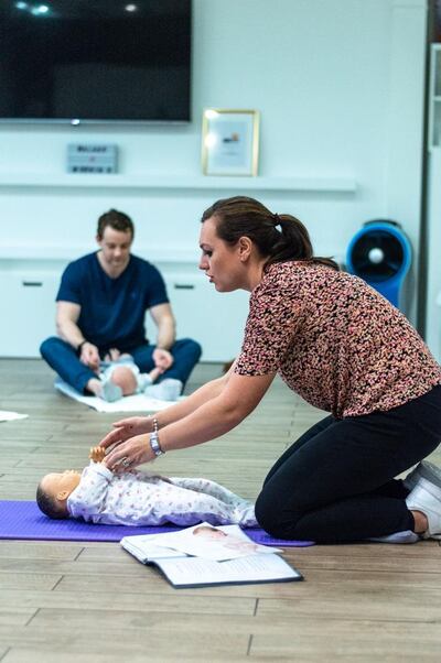 Louise Atkinson demonstrates baby massage techniques at one of the classes she runs. The technique can help new mothers bond with their babies (image taken pre-pandemic). Courtesy Louise Atkinson