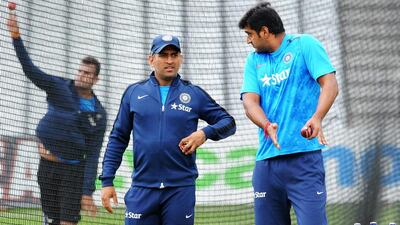 Captain MS Dhoni, left, and Pankaj Singh talk during net practice for the first Test between England and India at Trent Bridge cricket ground, Nottingham, England. Dhoni says India is young but prepared to break their losing streak in away Tests that has run more than three years and 14 matches. Rui Vieira / AP Photo