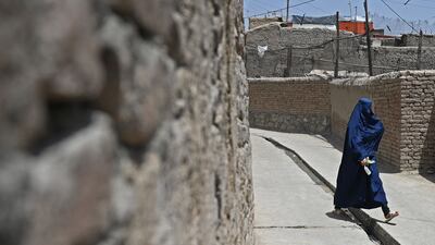 An Afghan woman in an alley in Kabul's old quarter.