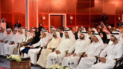 Sheikh Mohammed bin Rashid, Vice President and Ruler of Dubai, centre, Sheikh Hamdan bin Mohammed, Crown Prince of Dubai, centre left, Sheikh Maktoum bin Mohammed, Deputy Ruler of Dubai, third from right, Dr Sultan Al Jaber, chairman of Masdar, centre right, Mohamed Al Mahmood, chairman and managing director of Abu Dhabi Media, right, Mohammed Al Otaiba, editor-in-chief of The National, fourth from left, Ibrahim Al Abed, director general of the National Media Council, fifth from left, and Mona Al Marri, director general of the Dubai Media Office, sixth from left.