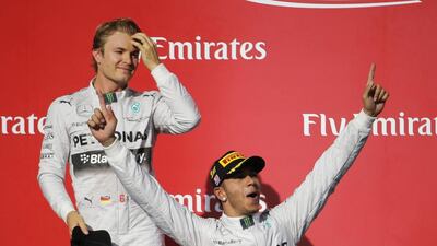 Lewis Hamilton, right, has thrived in the environment of the title chase. His Mercedes-GP teammate Nico Rosberg, not so much. Eric Gay / AP Photo