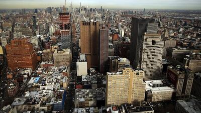 The Manhattan skyline as viewed from one of the top floors of a tower in New York City. Apartment prices have plunged in Manhattan. Spencer Platt / Getty