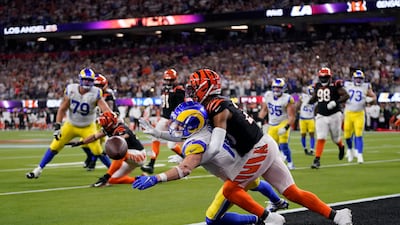 Los Angeles Rams wide receiver Cooper Kupp, bottom, can't catch a pass as he's held by Cincinnati Bengals cornerback Eli Apple. Reuters
