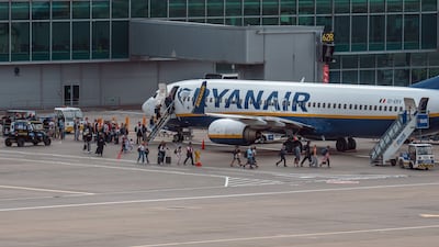 Passengers board a Ryanair flight at Stansted Airport near London after a 'technical issue' in air-traffic control disrupted flights. Getty Images