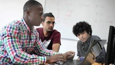 Left to right, Hassan Bello, 19, Murtaza Waheed, 25, and Ashiq Urrahman, 21, have developed an application to fight obesity. It includes exercise plans and nutritional advice, with access to fitness and diet professionals and a social forum where people can find motivation. Razan Alzayani / The National