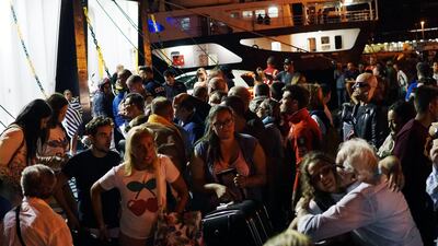 Tourists fleeing from Ischia Island arrive in Pozzuoli, near Naples. Cesare Abbate / EPA