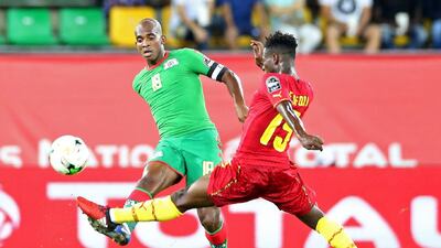 Burkina Faso's midfielder Charles Kabore, left. Steve Jordan / AFP