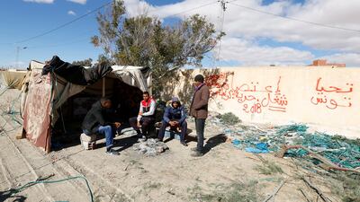 Protesters sit outside a tent near the entrance of the phosphate mine in Umm Al Arais, Tunisia. Zoubeir Souissi/Reuters