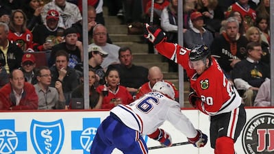 Brandon Saad, right, of the Chicago Blackhawks skates around Josh Gorges of the Montreal Canadiens at the United Center on April 9, 2014, in Chicago, Illinois. Jonathan Daniel / Getty Images
