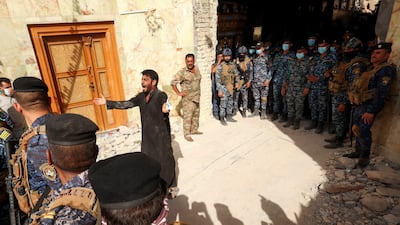A man cries as rescue workers prepare search for survivors in the rubble. Reuters