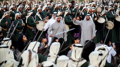Sheikh Saif bin Zayed, Deputy Prime Minister and Minister of Interior, Sheikh Omar bin Zayed, Deputy Chairman of the Board of Trustees of Zayed bin Sultan Al Nahyan Charitable and Humanitarian Foundation, and Sheikh Abdullah bin Mohamed, take part in a traditional dance