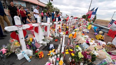 People leave flowers at a makeshift memorial for shooting victims at the Cielo Vista Mall Walmart, in El Paso, Texas. AFP